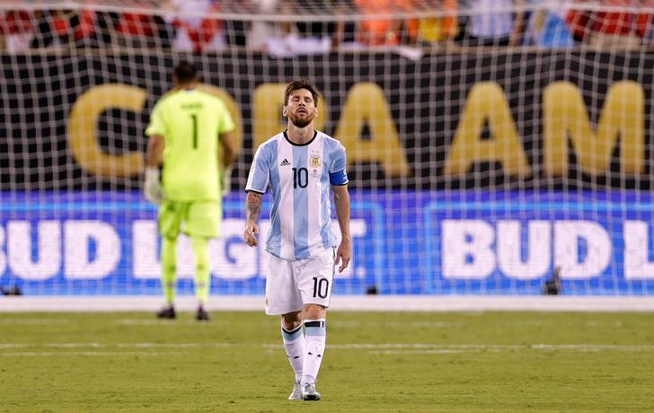 Jun 26, 2016; East Rutherford, NJ, USA; Argentina midfielder Lionel Messi (10) reacts after missing a shot during the shoot out round against Chile in the championship match of the 2016 Copa America Centenario soccer tournament at MetLife Stadium. Chile won. Mandatory Credit: Adam Hunger-USA TODAY Sports